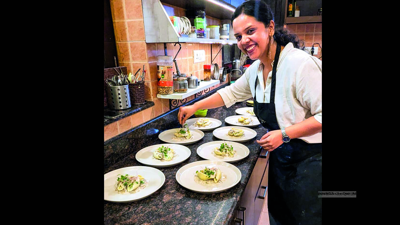 A glimpse of Venuka, founder of Yours Breadly Supper Club, curating the supper plates