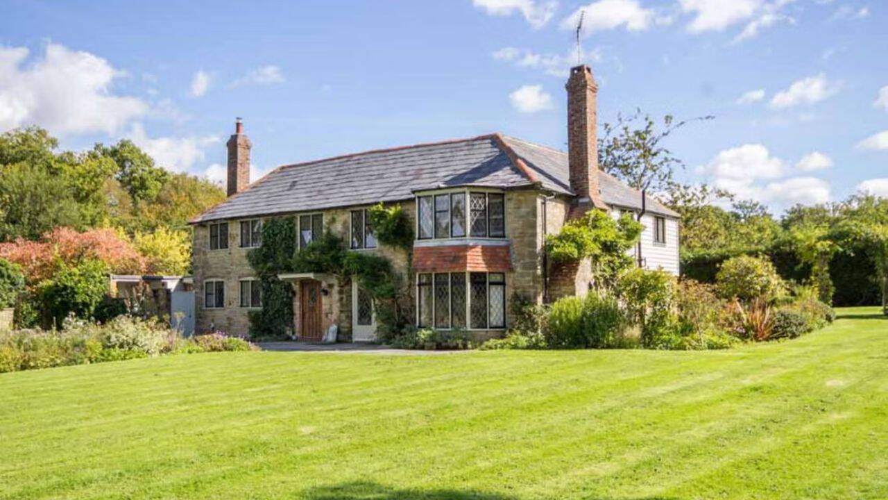 The £1.2 million home and its disputed dog-proof fence