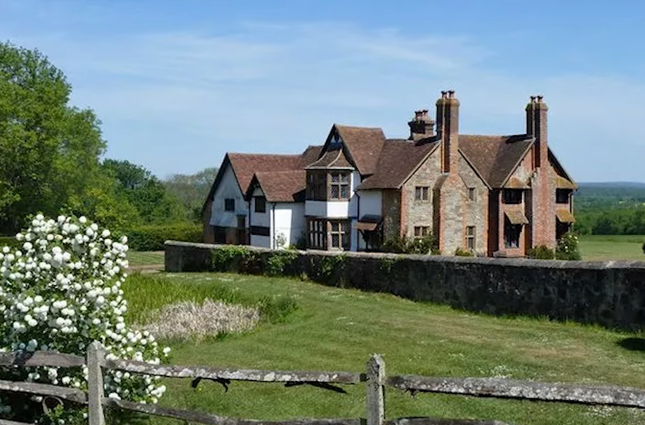 Dame Maggie Smith’s secluded Sussex farmhouse, where the late <em>Harry Potter</em> star lived for more than four decades. The Grade II-listed property features a vineyard, stable and barns.​