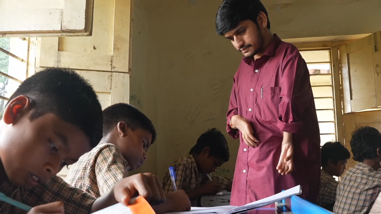 Born with disabilities in both hands and one leg, Naidu learnt to write with his feet. (Photo: BBC News Hindi)