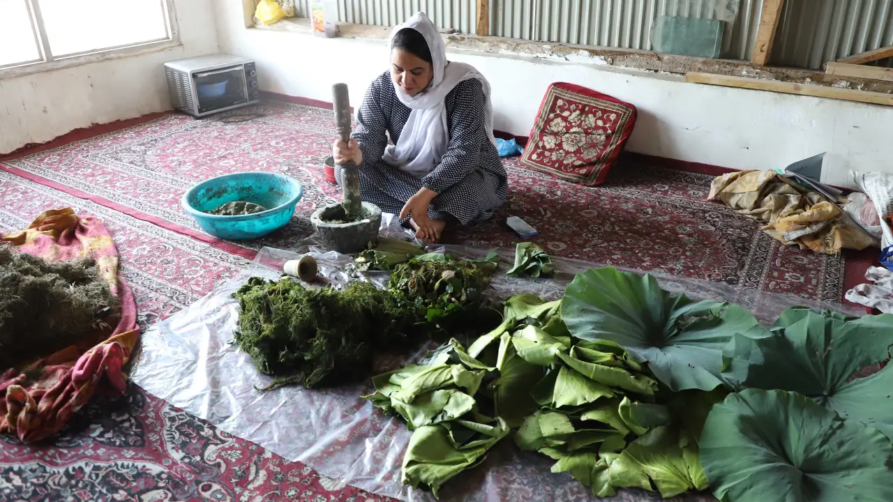 Irshad processes aquatic weeds into pulp to create an alternative to paper-based papier-mâché.<br>
