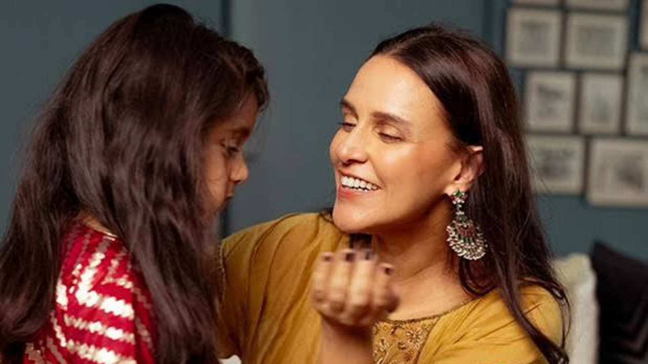Neha Dhupia with her daughter.