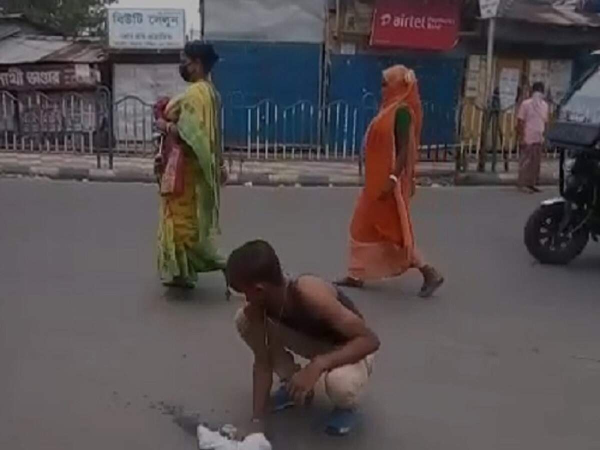 West Bengal: Man forced to clean road with own shirt after being caught spitting