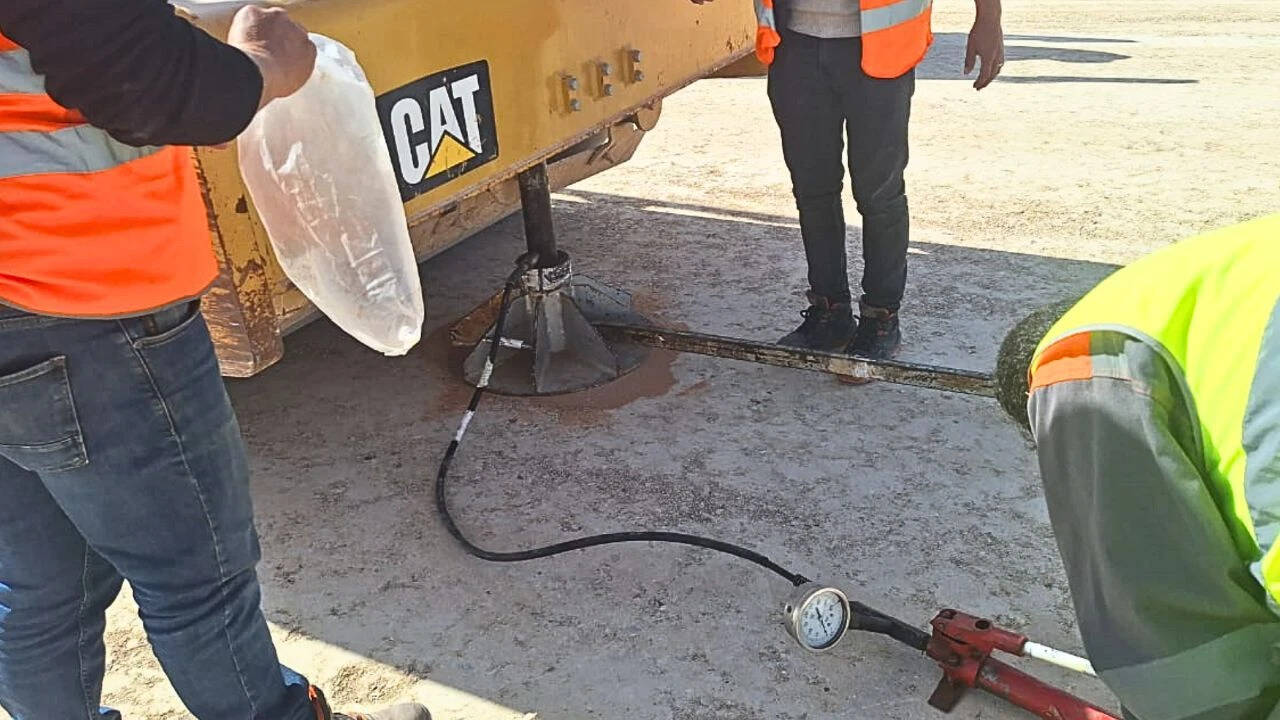 How did the Moroccan mine build a heavy-truck road from phosphate waste rock<br>
