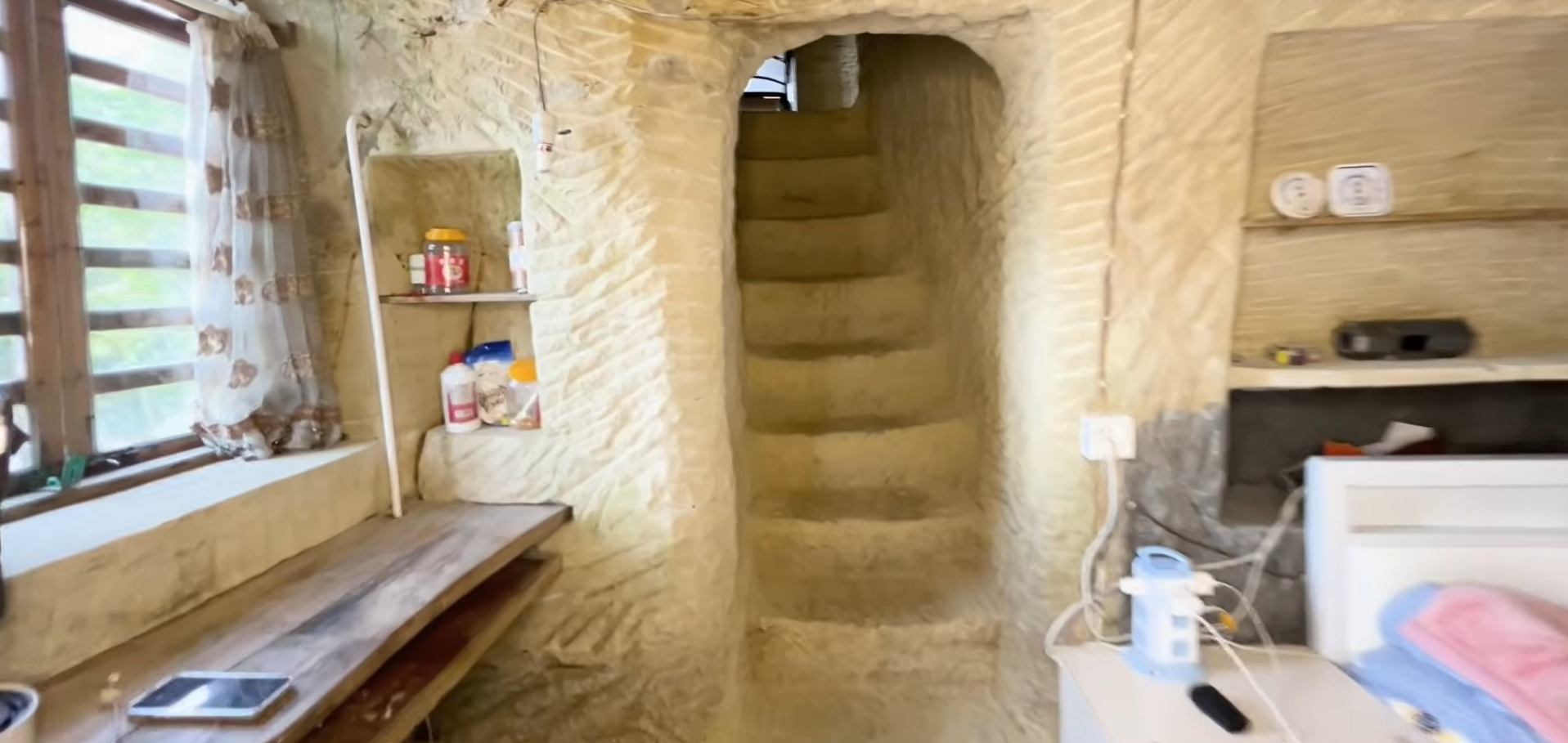 A staircase carved through solid sandstone: One of the project's biggest challenges was connecting both floors.<br>
