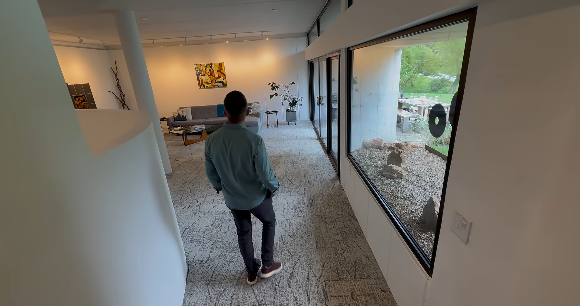 Large glass walls and skylights flood the underground home with natural light, challenging the idea that underground houses are dark and gloomy.
