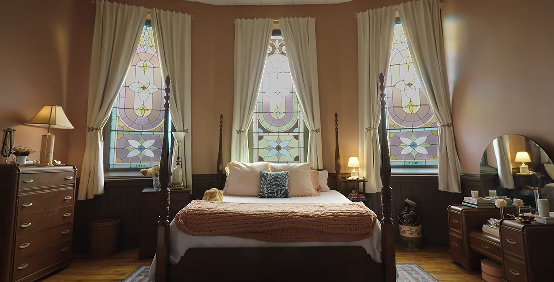 Anderson's renovation includes repurposed church pews, a library wall, stained-glass windows and a kitchen island made using an old door and a communion table.