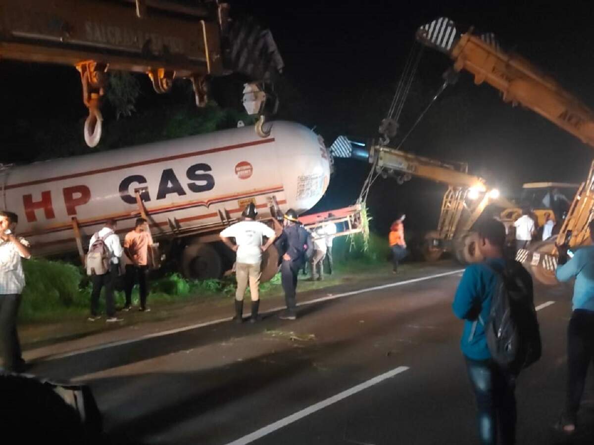 Gas tanker being removed from the railway track with the help of a crane.