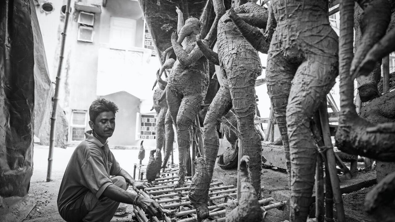 Artisan creating Durga idol