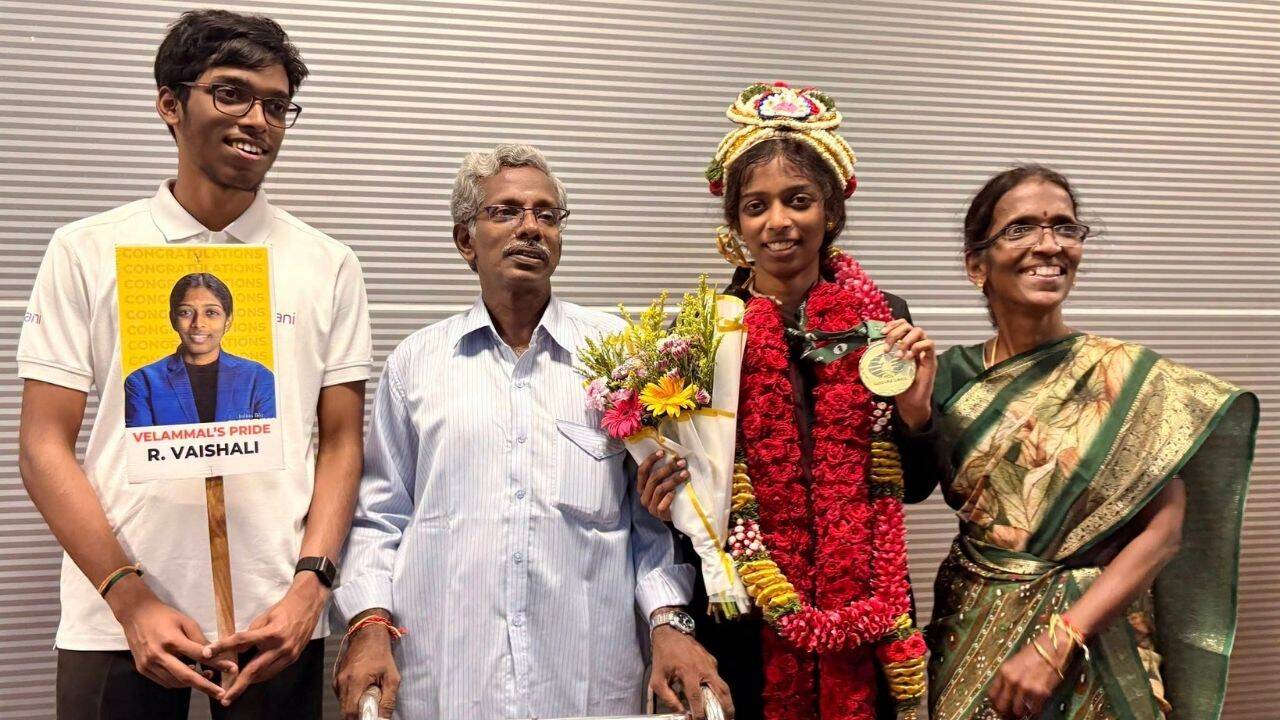 A family photo after Vaishali's Women's Candidates win (Tushar Damor/ChessBase India)
