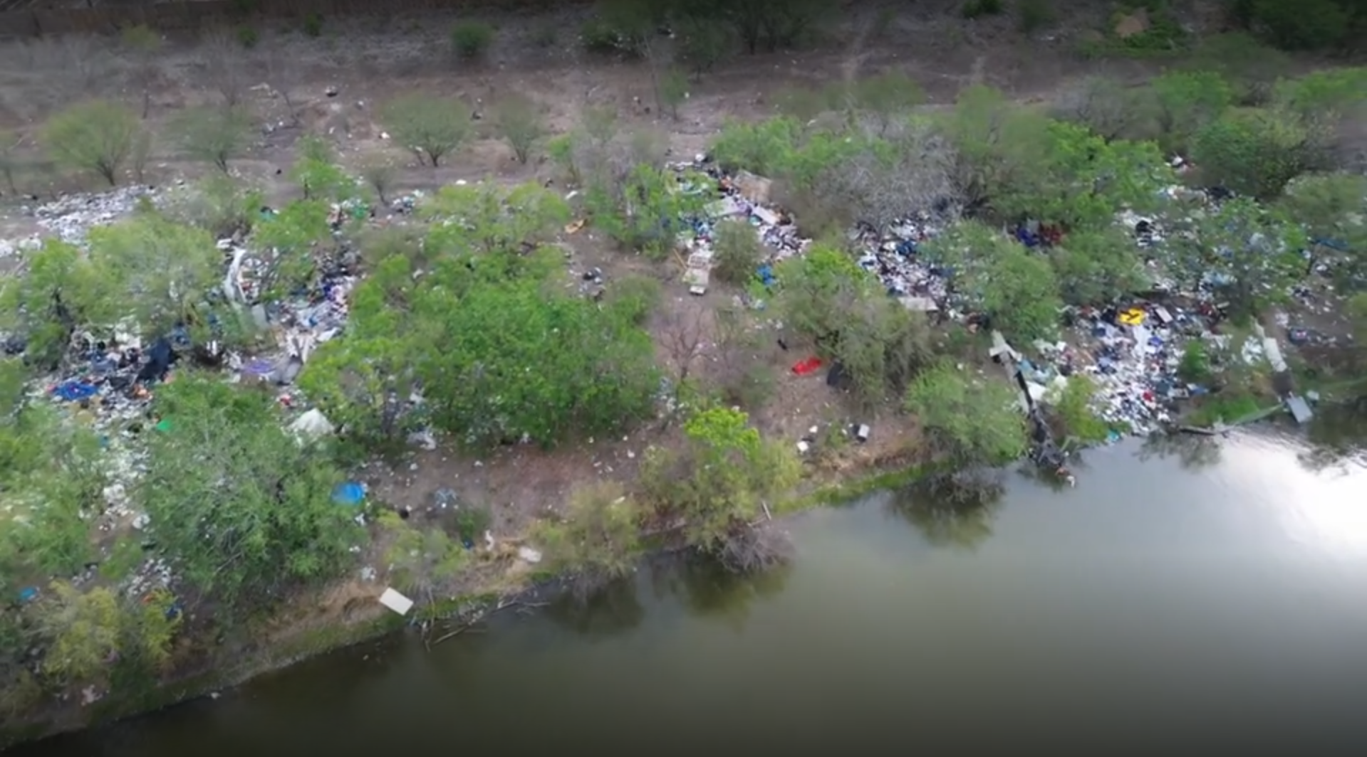 River Aid San Antonio volunteers and local residents work to restore a neglected Bexar County property.