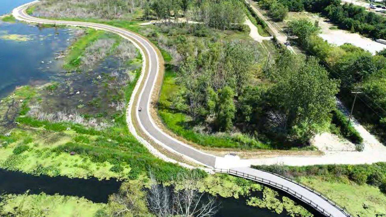 How much habitat and shoreline was restored around Muskegon Lake<br>