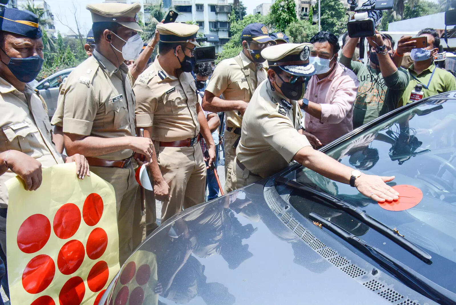 Mumbai police discontinues color coded emergency stickers but  thorough checks to continue.