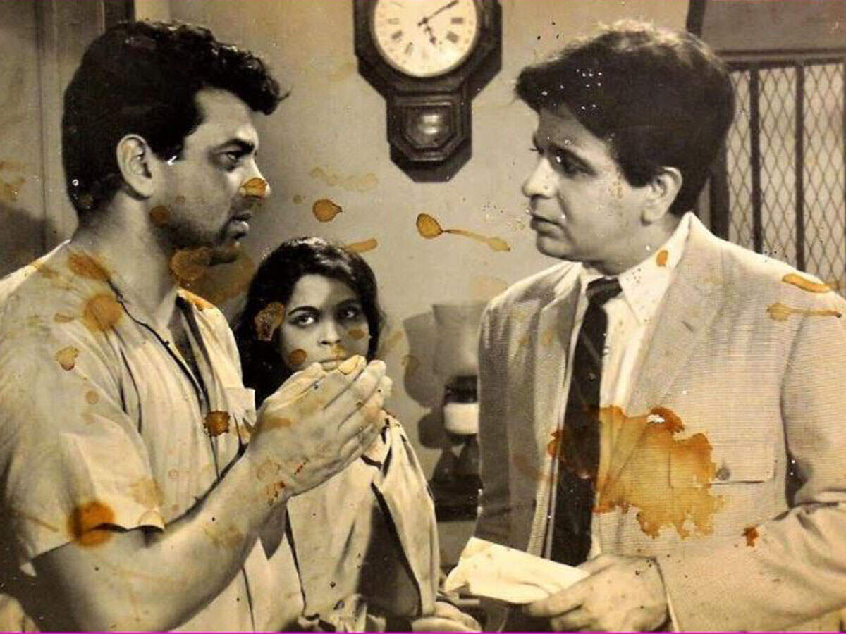 Dilip Kumar and Dharmendra in the lobby of the Bengali film titled 'Paari'.