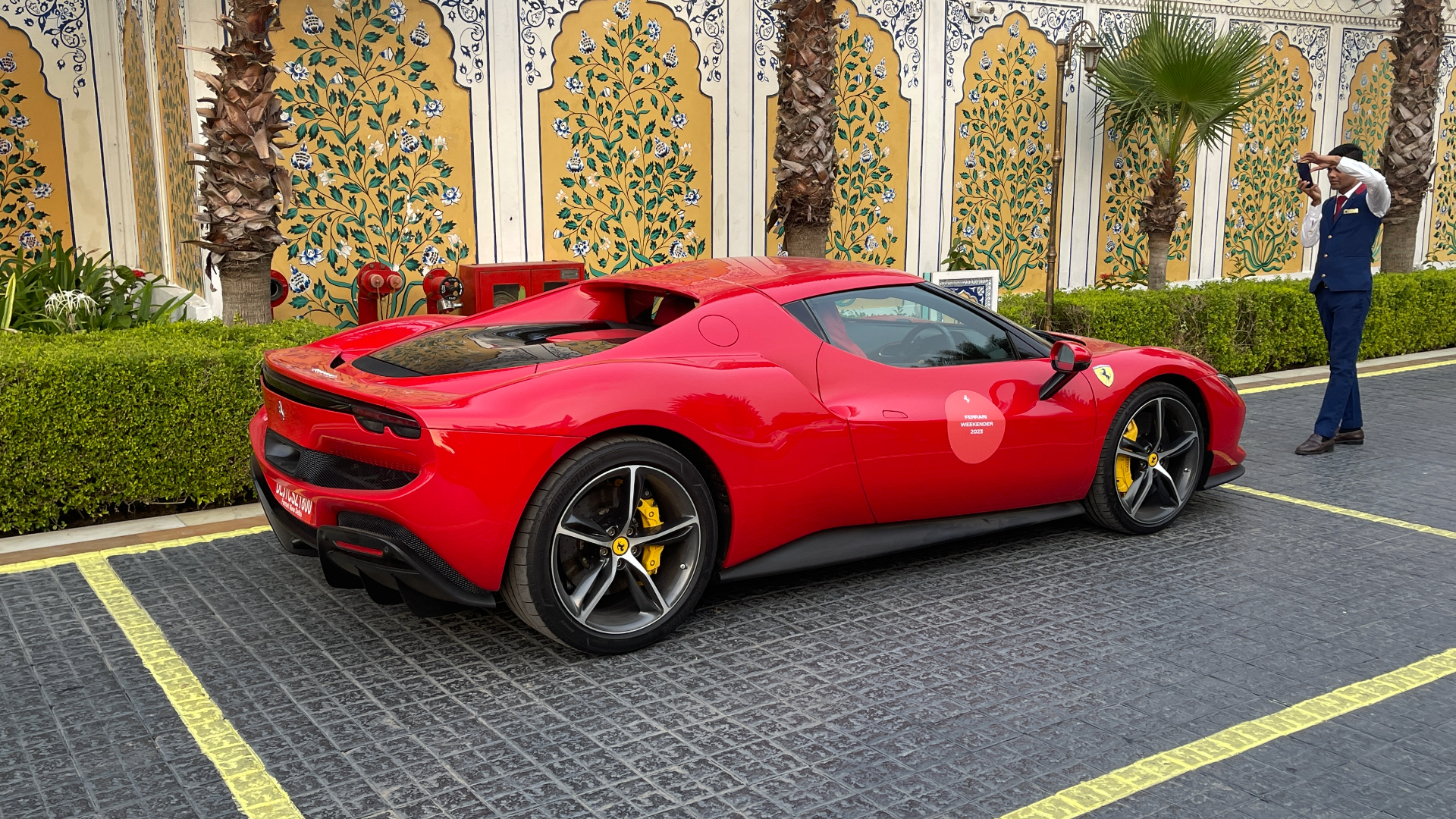 Hotel staff taking a moment to capture the 296 GTB