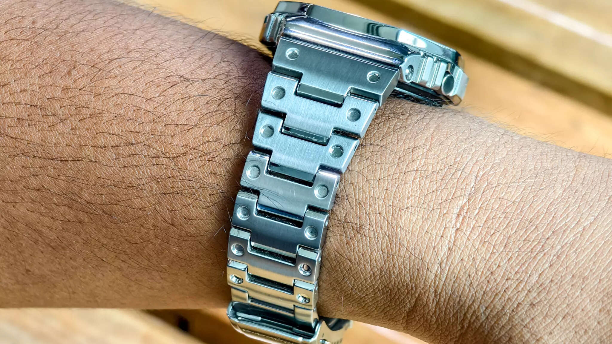 The steel bracelet has these circular indents adds up to its looks