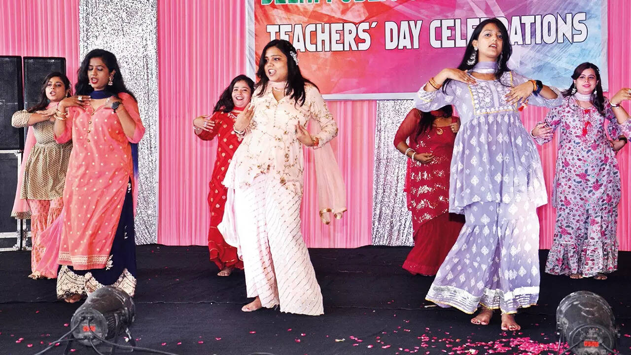 Teachers performing on stage during the event