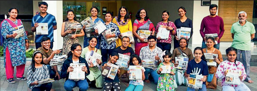 Residents of Poorna Pragna Layout in Uttarahalli with the bags they made from old newspapers