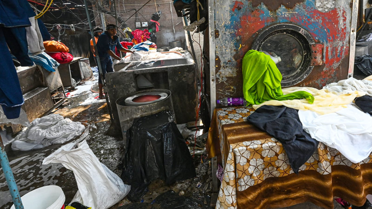 Invisible under busy flyover, people who do Delhi's laundry