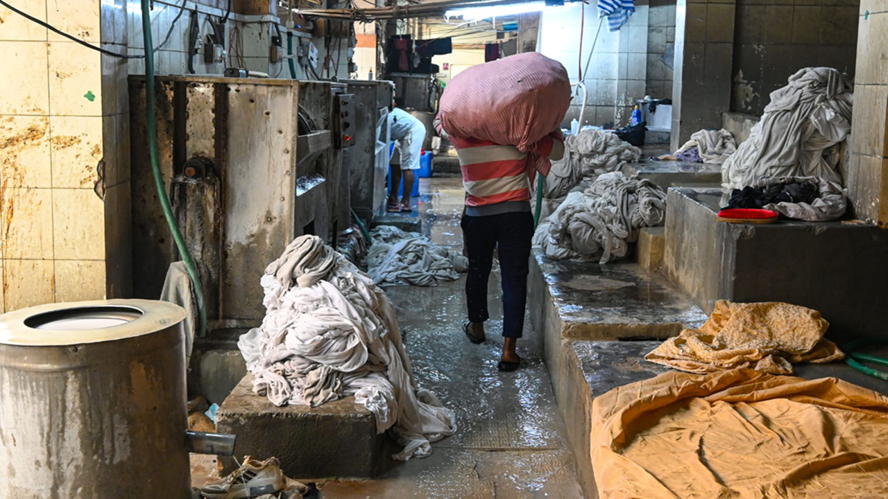 Invisible under busy flyover, people who do Delhi's laundry