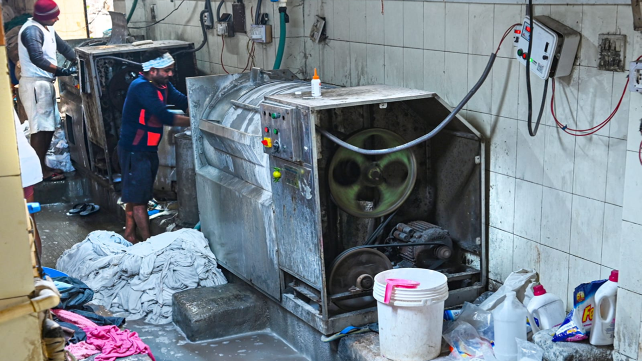 Invisible under busy flyover, people who do Delhi's laundry