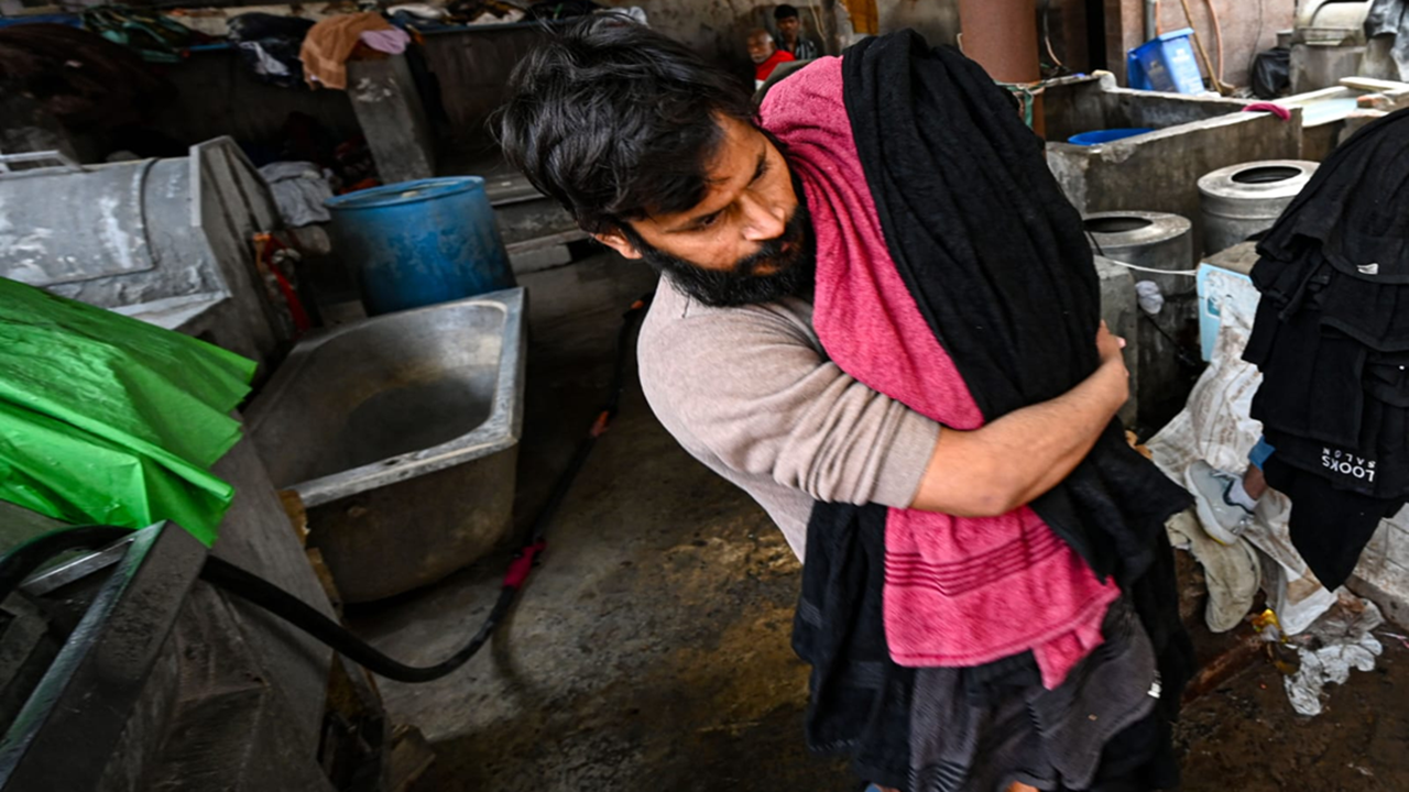 Invisible under busy flyover, people who do Delhi's laundry