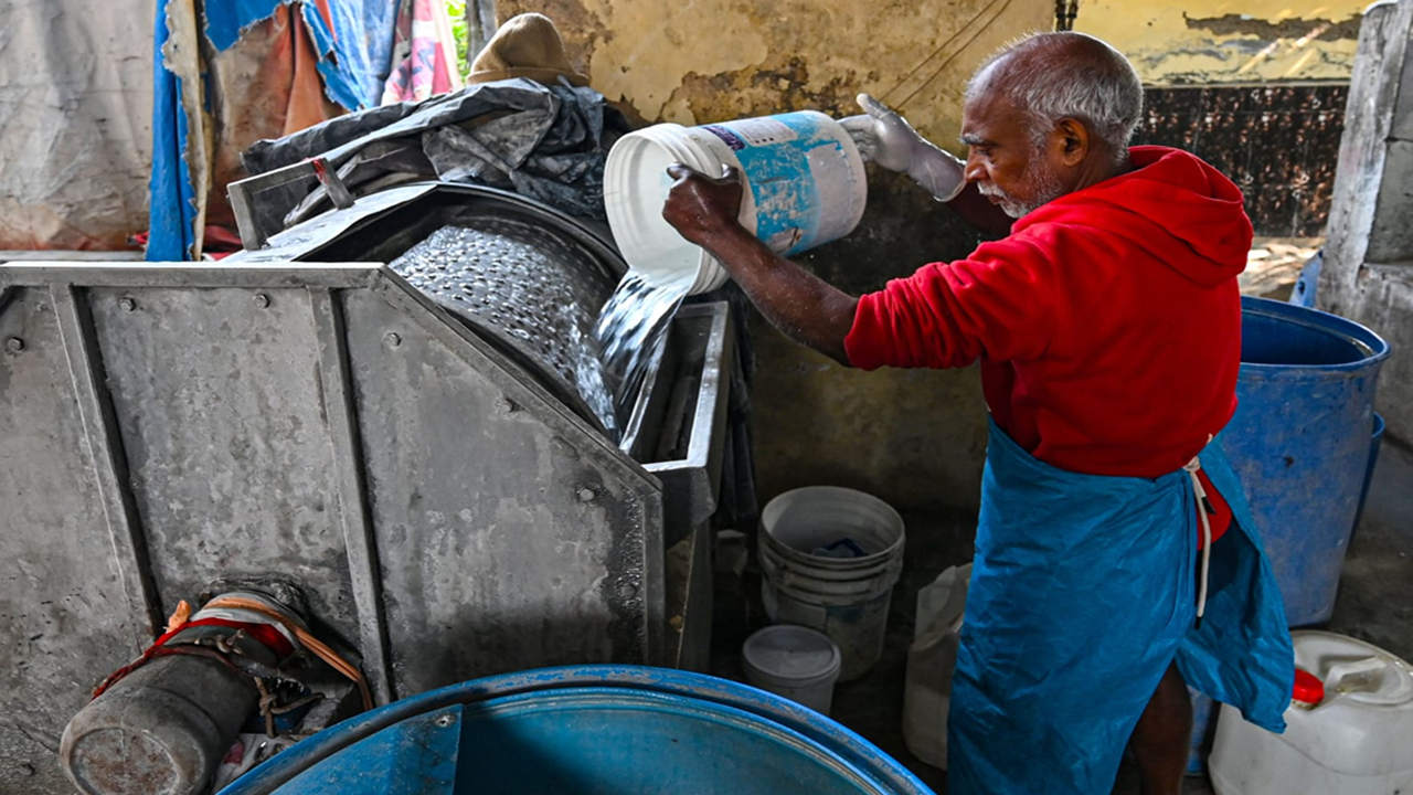 Invisible under busy flyover, people who do Delhi's laundry