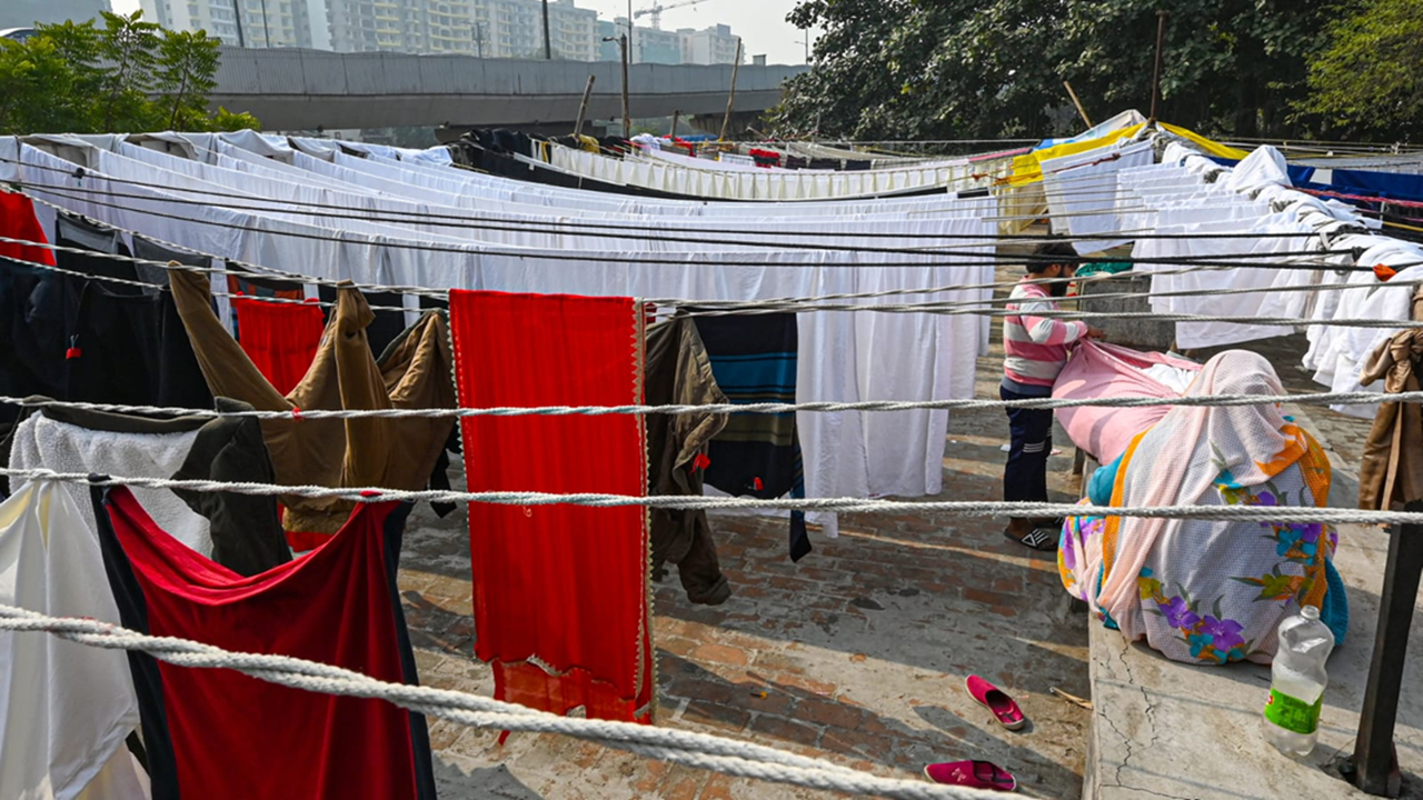 Invisible under busy flyover, people who do Delhi's laundry