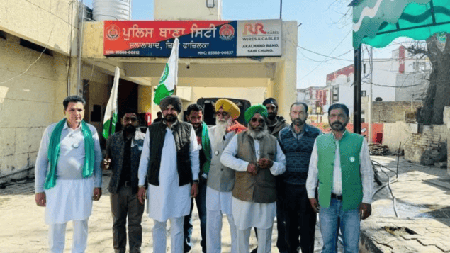 Farmers protest outside Jalalabad City police station in Fazilka