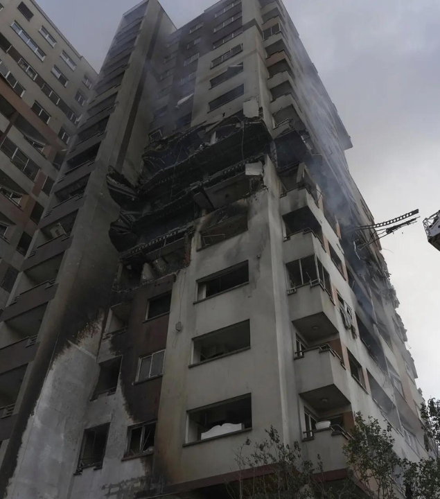 Damaged residential building in Iran by Israeli airstrike (AP)