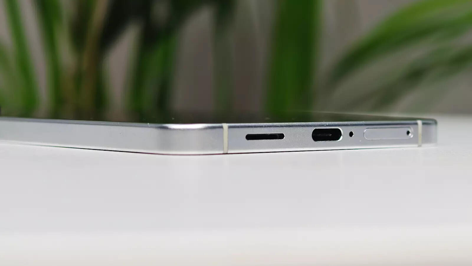 The bottom Edge has the usuals... a USB-C port, a SIM tray, and a speaker cutout