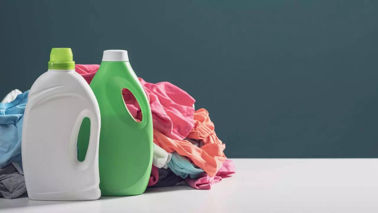 Use less detergent and add white vinegar or Dettol