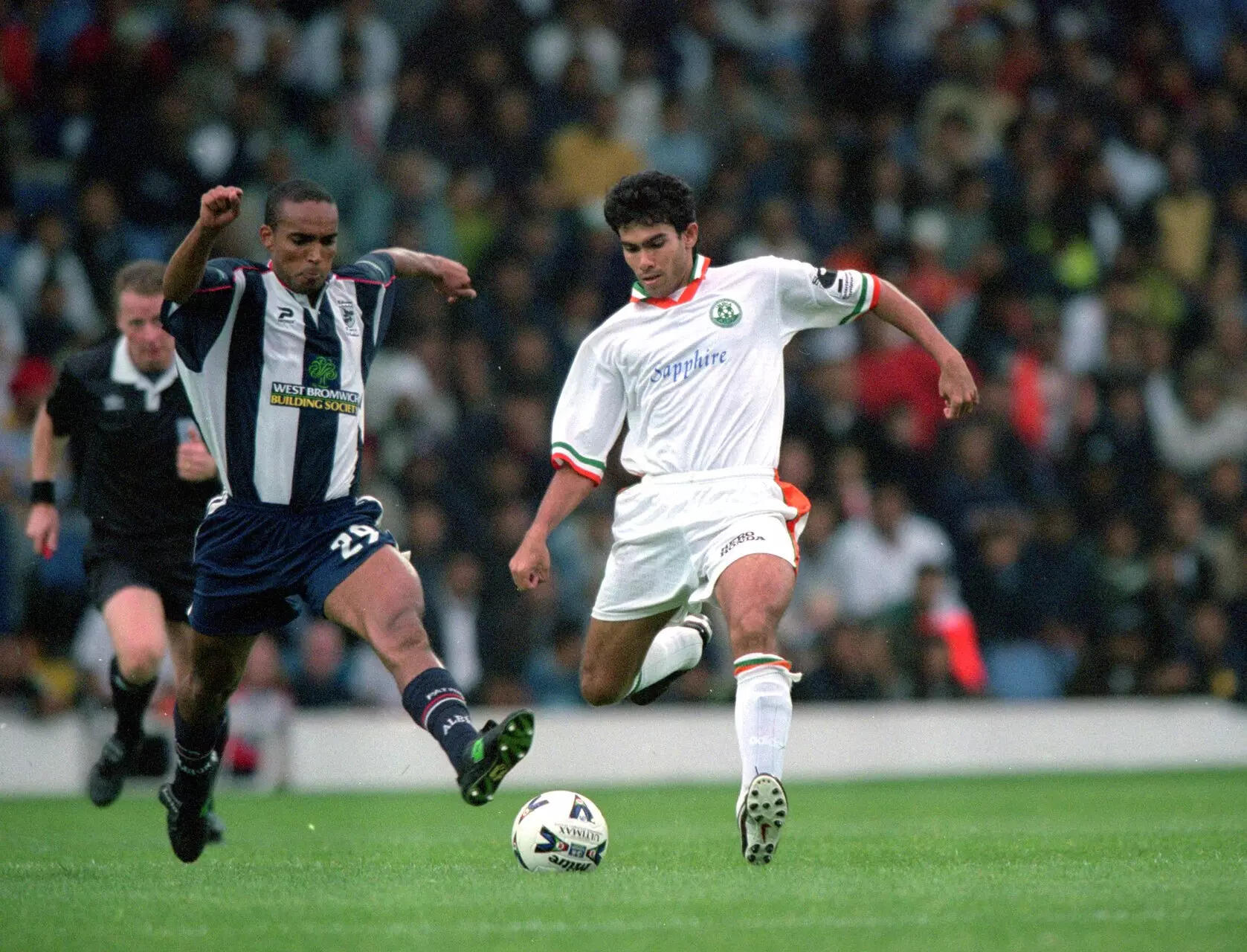 Khalid Jamil (in white) of India clears the ball ahead of Jordao of West Brom during the Pre-Season Friendly match at The Hawthorns, in Birmingham, England (Image Credit: Shaun Botterill/Allsport) Khalid Jamil, Jordao