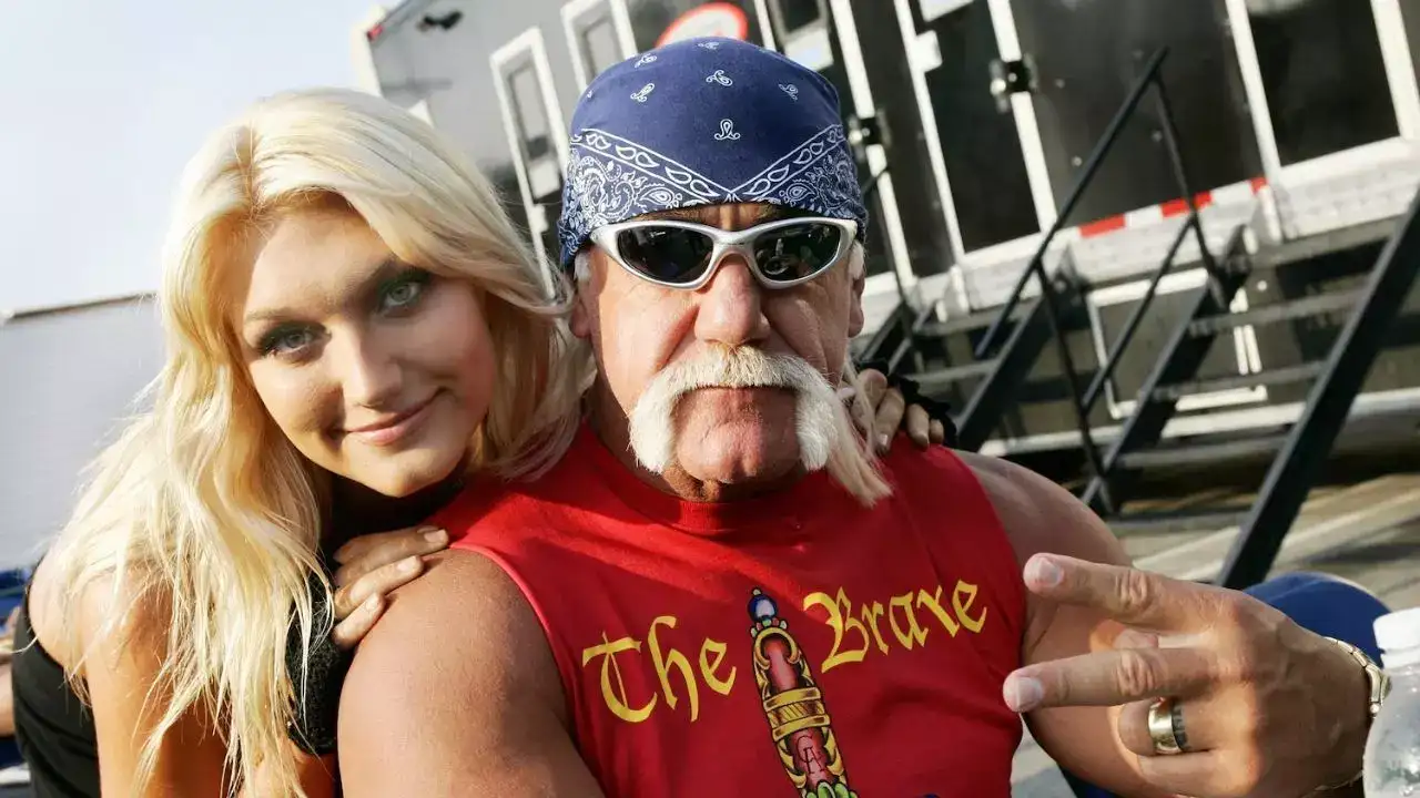 Hulk Hogan with his daughter Brooke Hogan. Image via: Vince Bucci/Getty Images, FILE Hulk Hogan with his daughter Brooke Hogan
