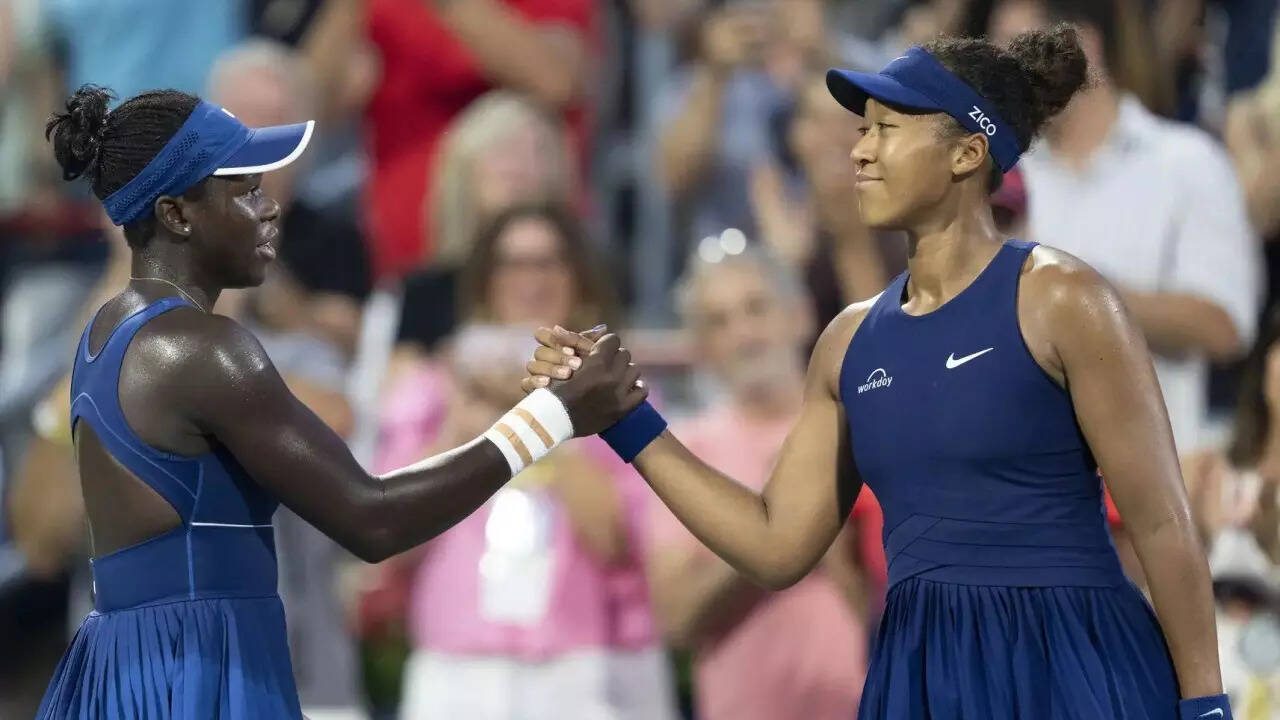 Victoria Mboko (L) and Naomi Osaka (R) at the net after their WTA Montreal final match. (AP) Mboko Osaka AP