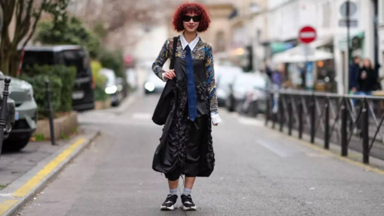 Sneakers styled with dress