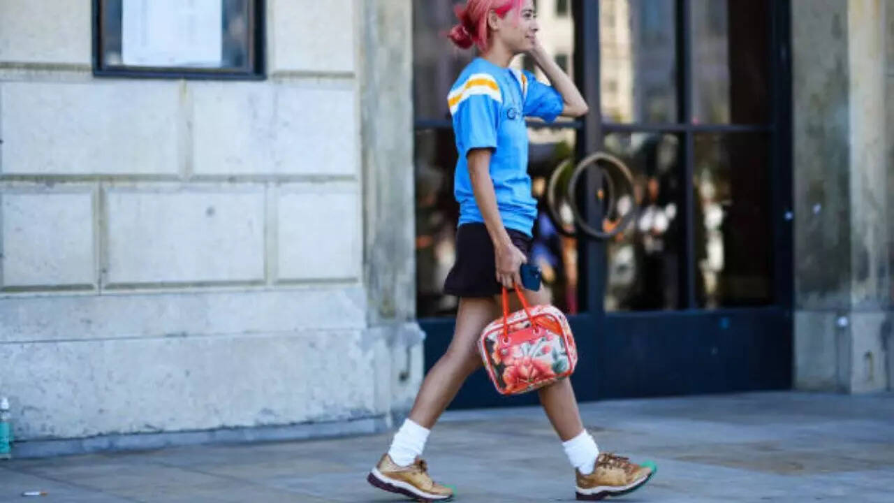 Sneakers styled with dress