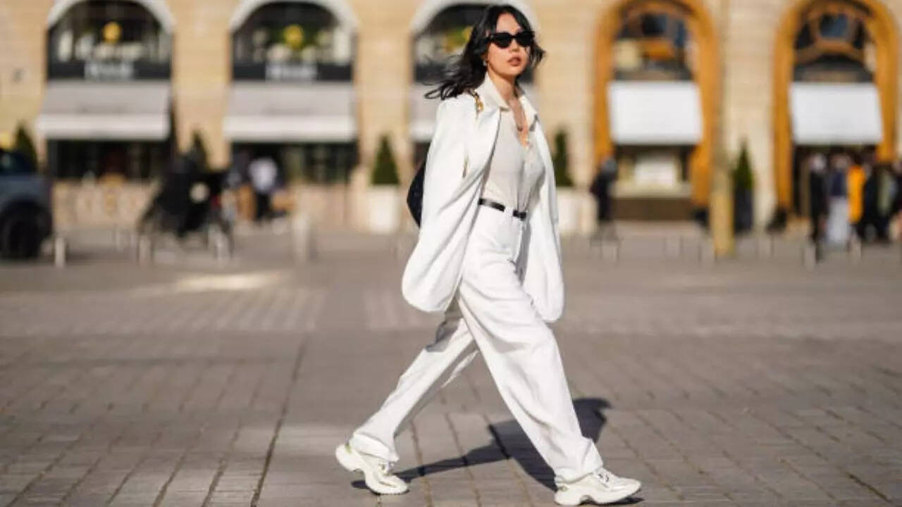 Sneakers styled with dress