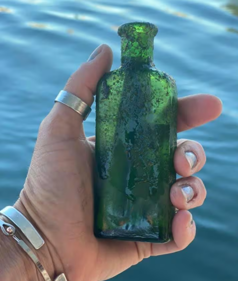 Scuba diver finds a 99 year old pen note (Photo: Nautical North Family Adventures)