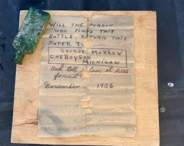 Scuba diver finds a 99 year old pen note (Photo: Nautical North Family Adventures)