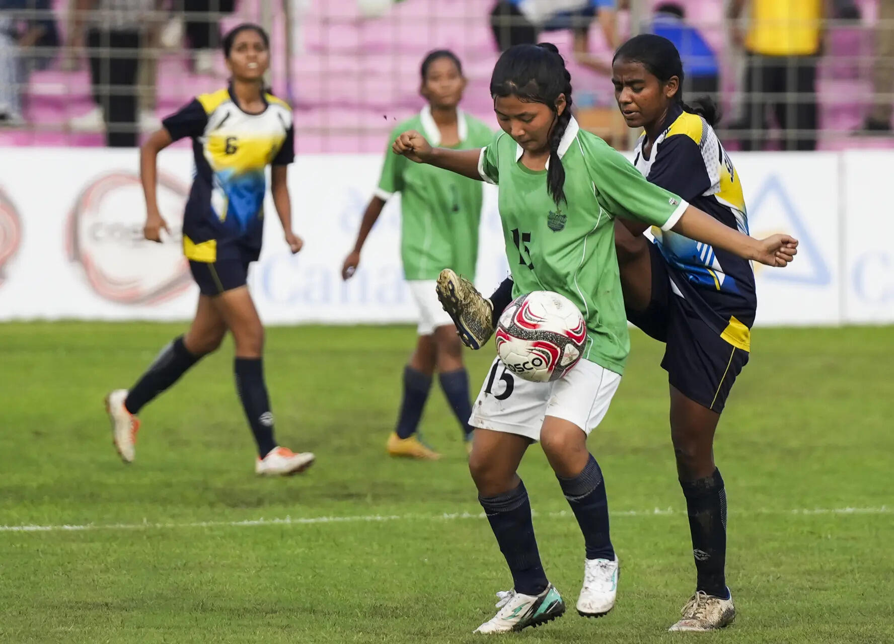 Players of Arunachal Pradesh (green) and Sainik School, Odisha, vie for the ball during the Junior Girls Under-17 match at 64th Subroto Cup International Football Tournament (PTI Photo) 64th Subroto Cup International Football Tournament