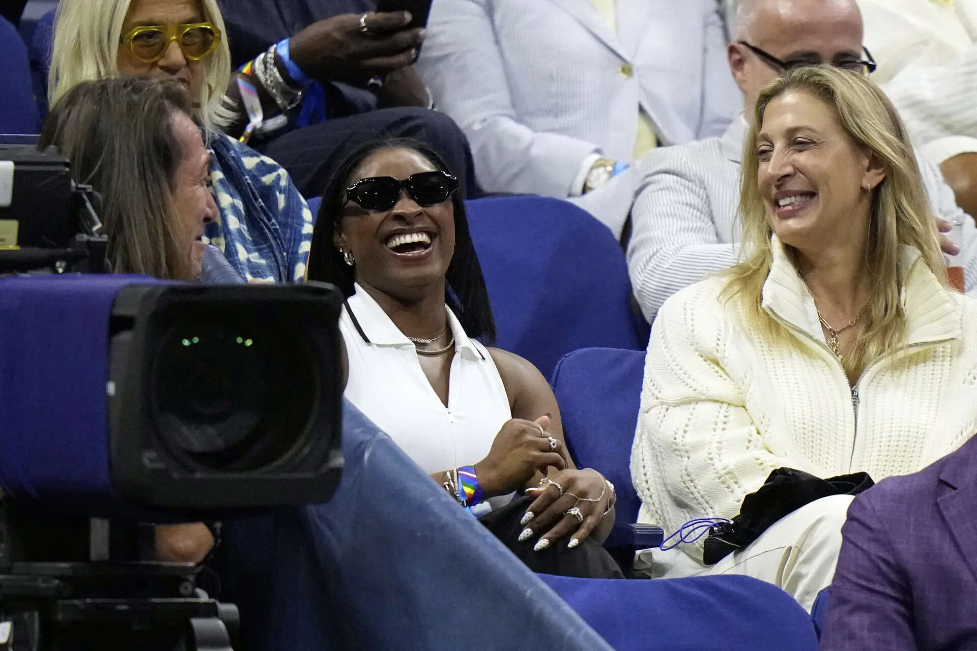Gymnast and Olympic champion Simone Biles (C) participated in the second round match of Coco Goff at the US Open. (AP) Simone Biles gives some inspiration and calm feeling to Coco Goff at the US Open