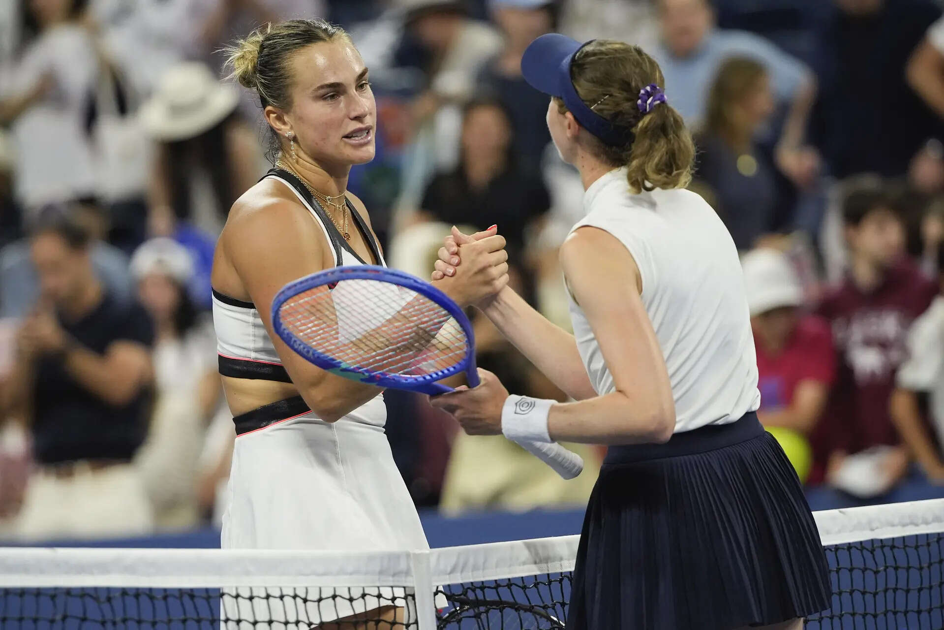 Aryna Sabalenka, of Belarus, shakes hands with Cristina Bucsa, of Spain, after winning their fourth round match of the US Open tennis championships, Sunday, Aug. 31, 2025, in New York. (AP Photo/Pamela Smith) US Open Tennis