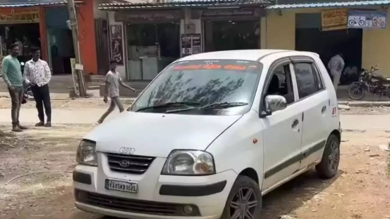 The car in which the deceased was travelling when she was attacked by Vittal and the location where he set fire on her. (Image TOI) Image Credit: TOI
