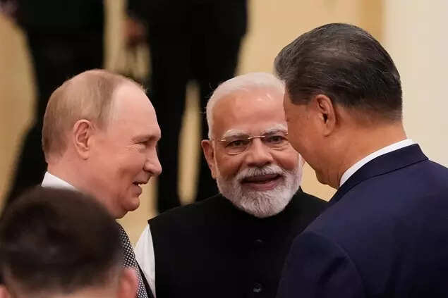 Russian President Vladimir Putin, from left, PM Modi and Xi Jinping talk ahead of the Shanghai Cooperation Organization (SCO) summit at the Meijiang Convention and Exhibition Center in Tianjin, China, Monday, Sept. 1, 2025.