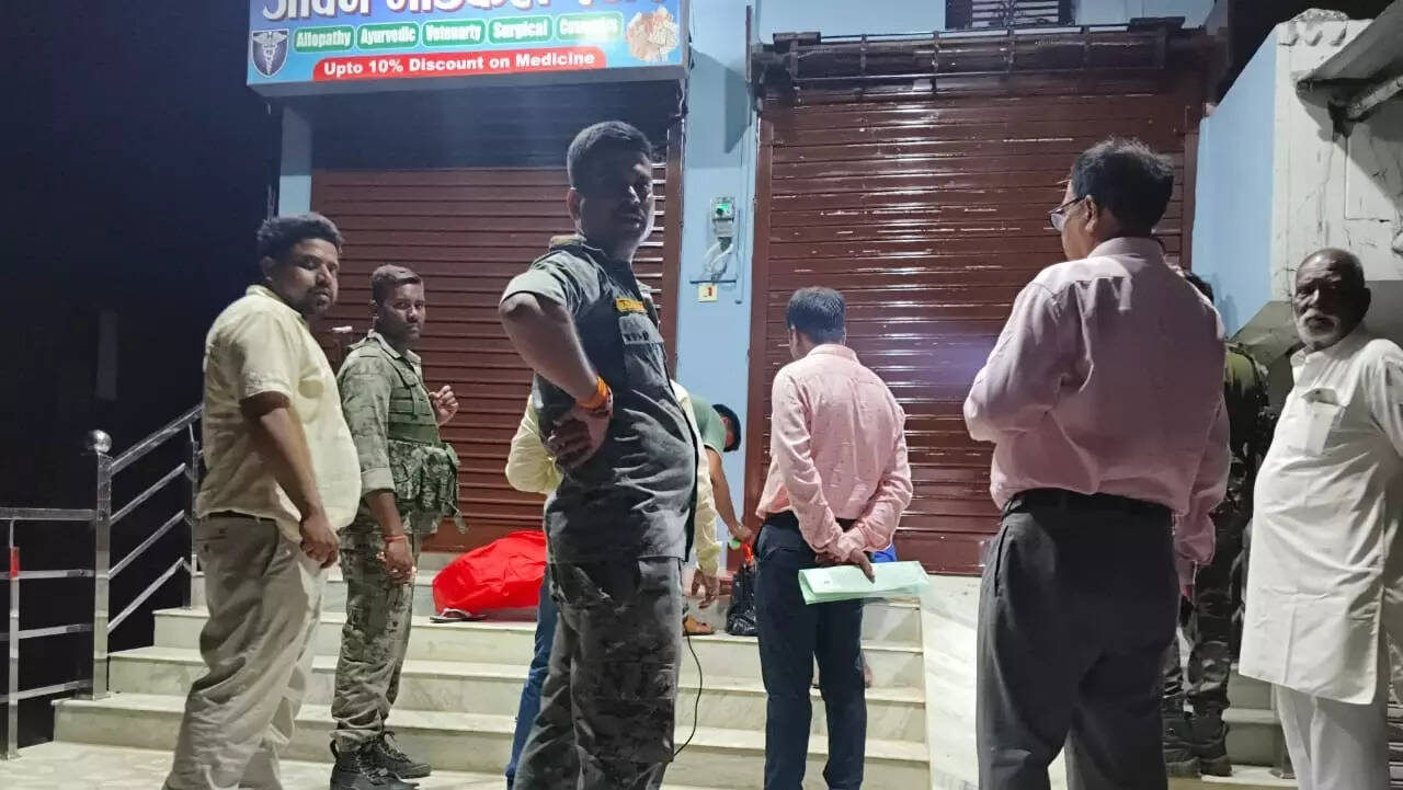 Officials outside the clinic