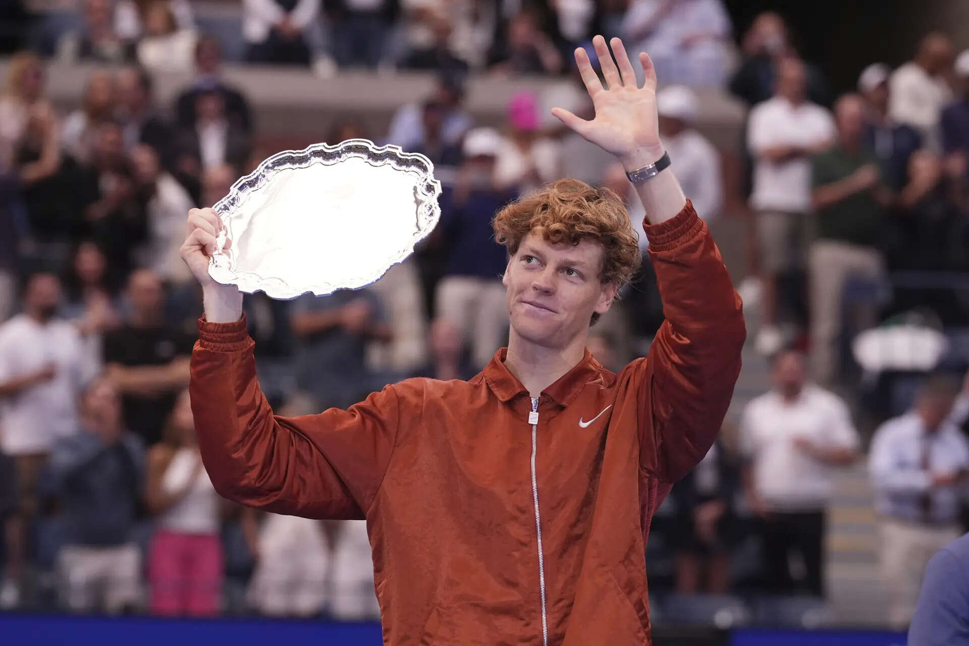 Jannik Sinner lifts his trophy after losing to Carlos Alcaraz. (AP Photo) Jannik Sinner