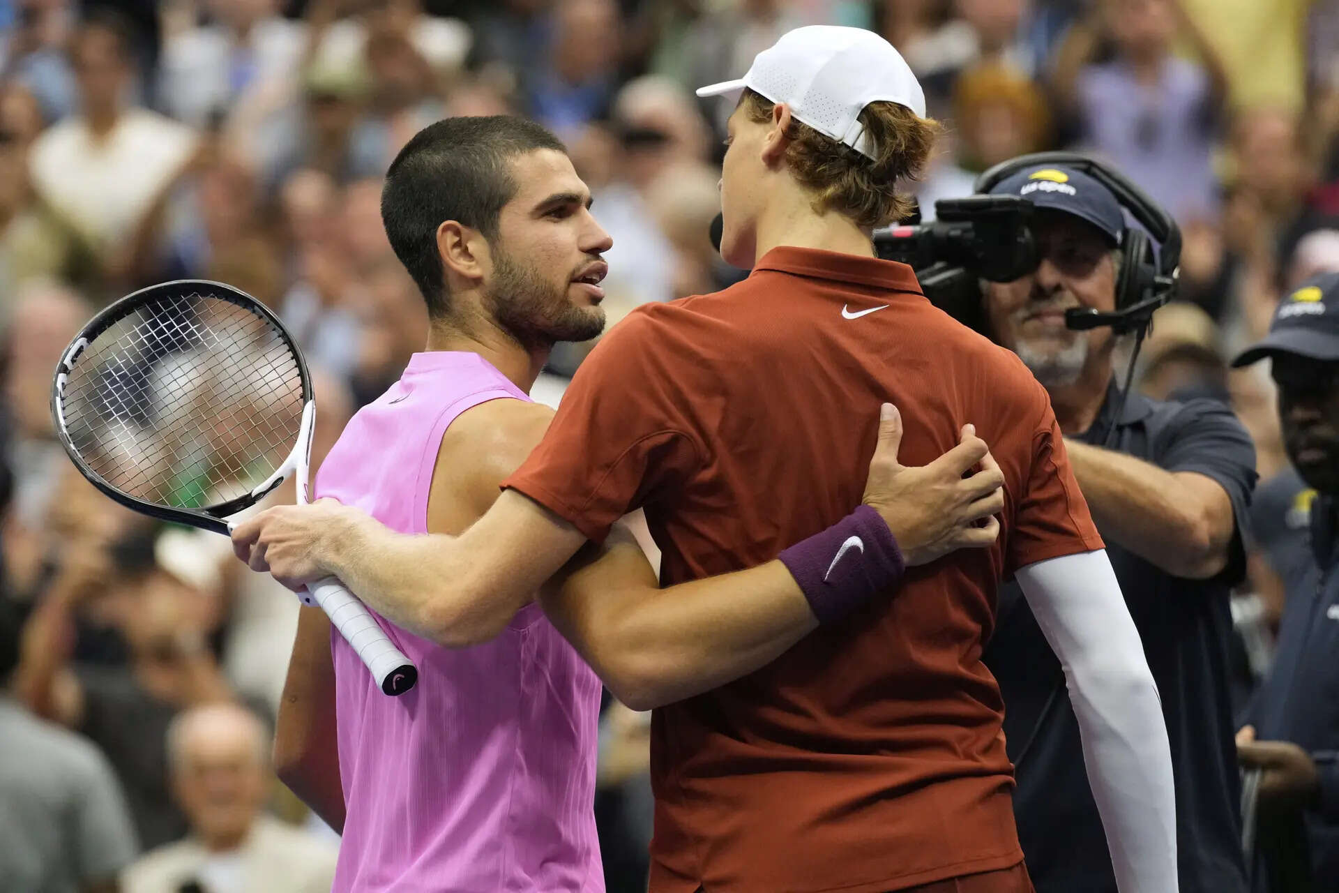Carlos Alcaraz, left, and Jannik Sinner embrace after their men's singles final of the US Open. (AP Photo) US Open