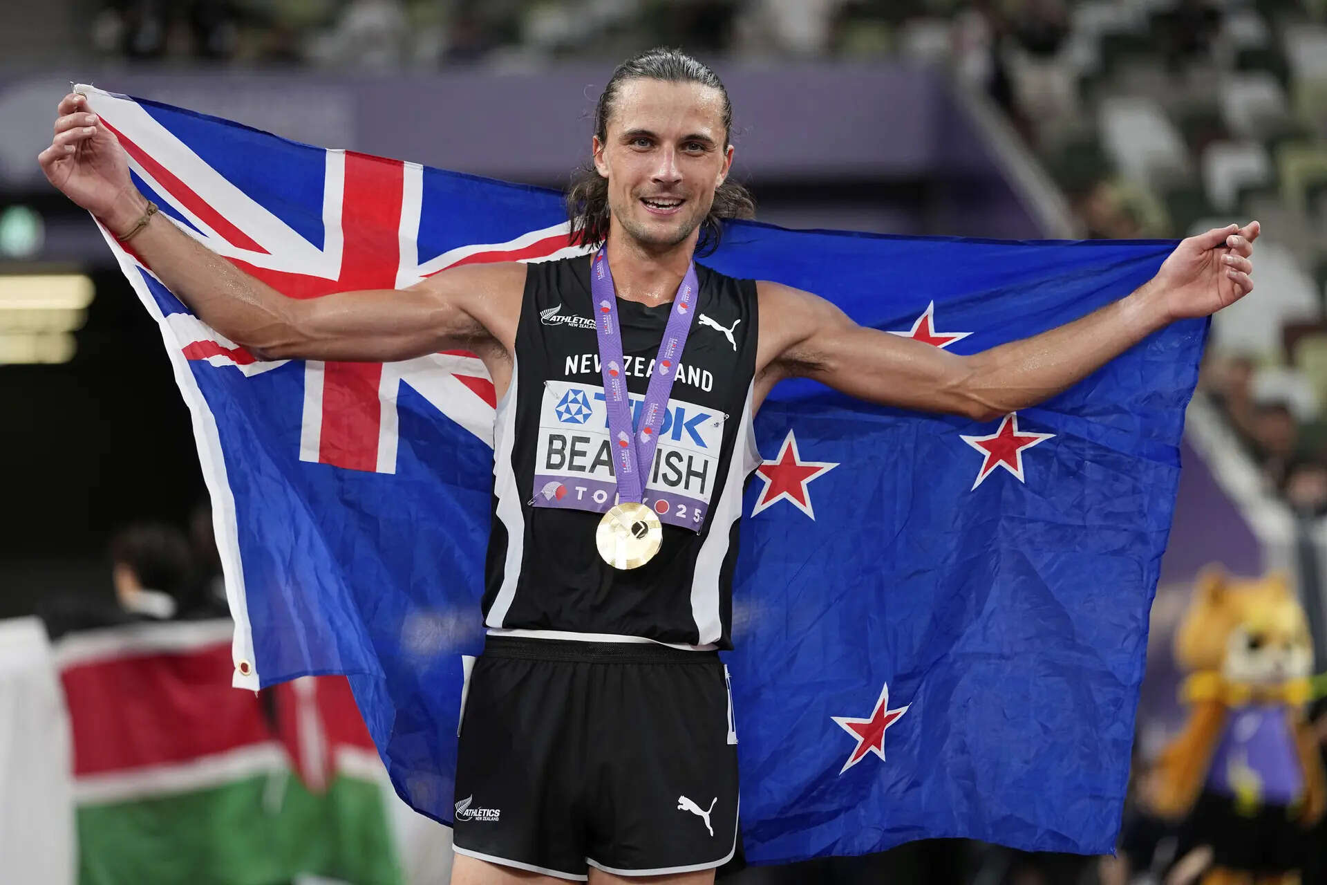 New Zealand's Geordie Beamish poses after winning the gold medal in the men's 3,000 meters steeplechase final at the World Athletics Championships in Tokyo. (AP) Japan Athletics Worlds