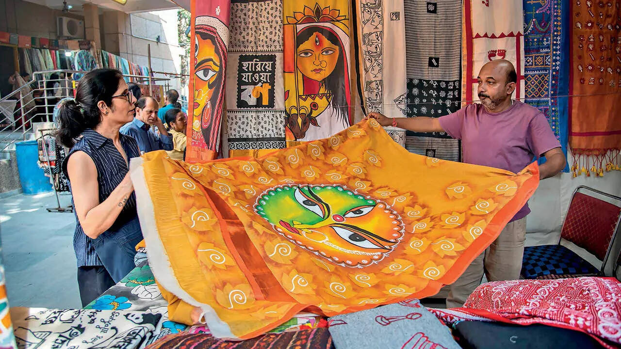 Bengal weavers and artists showing their hand-painted sari collection to Delhi's handloom lovers